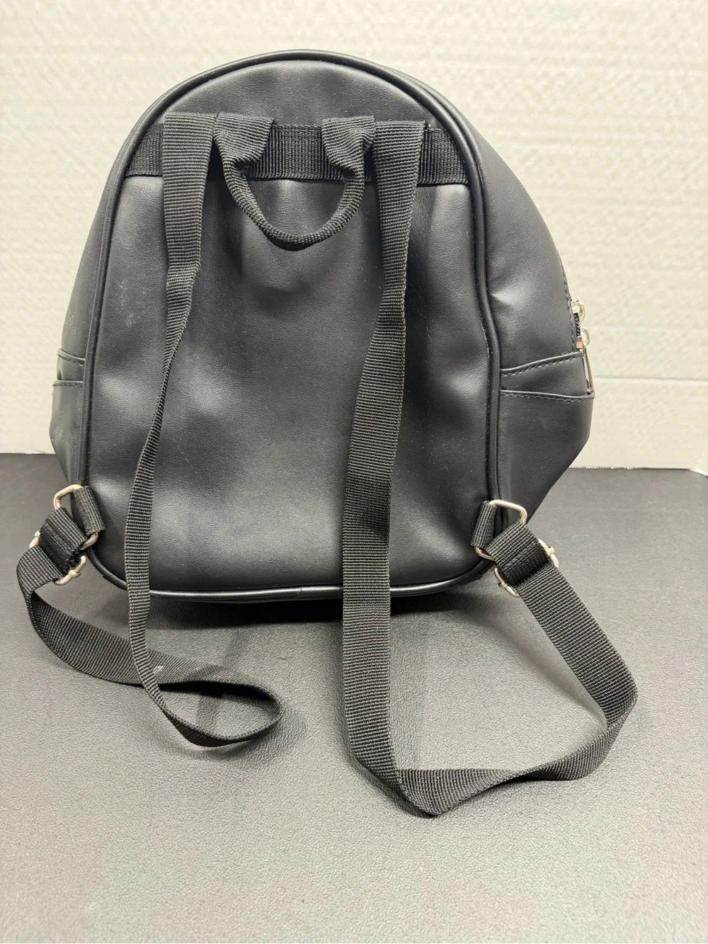 Mini Black Crest Backpack with Front Buckle Pocket